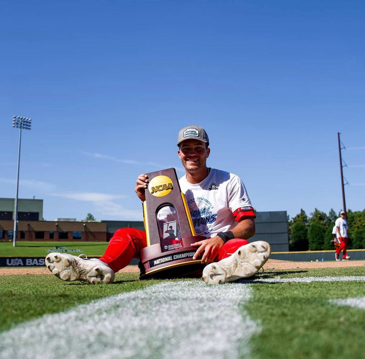 TJ Palma holding the NCAA National Championship trophy
